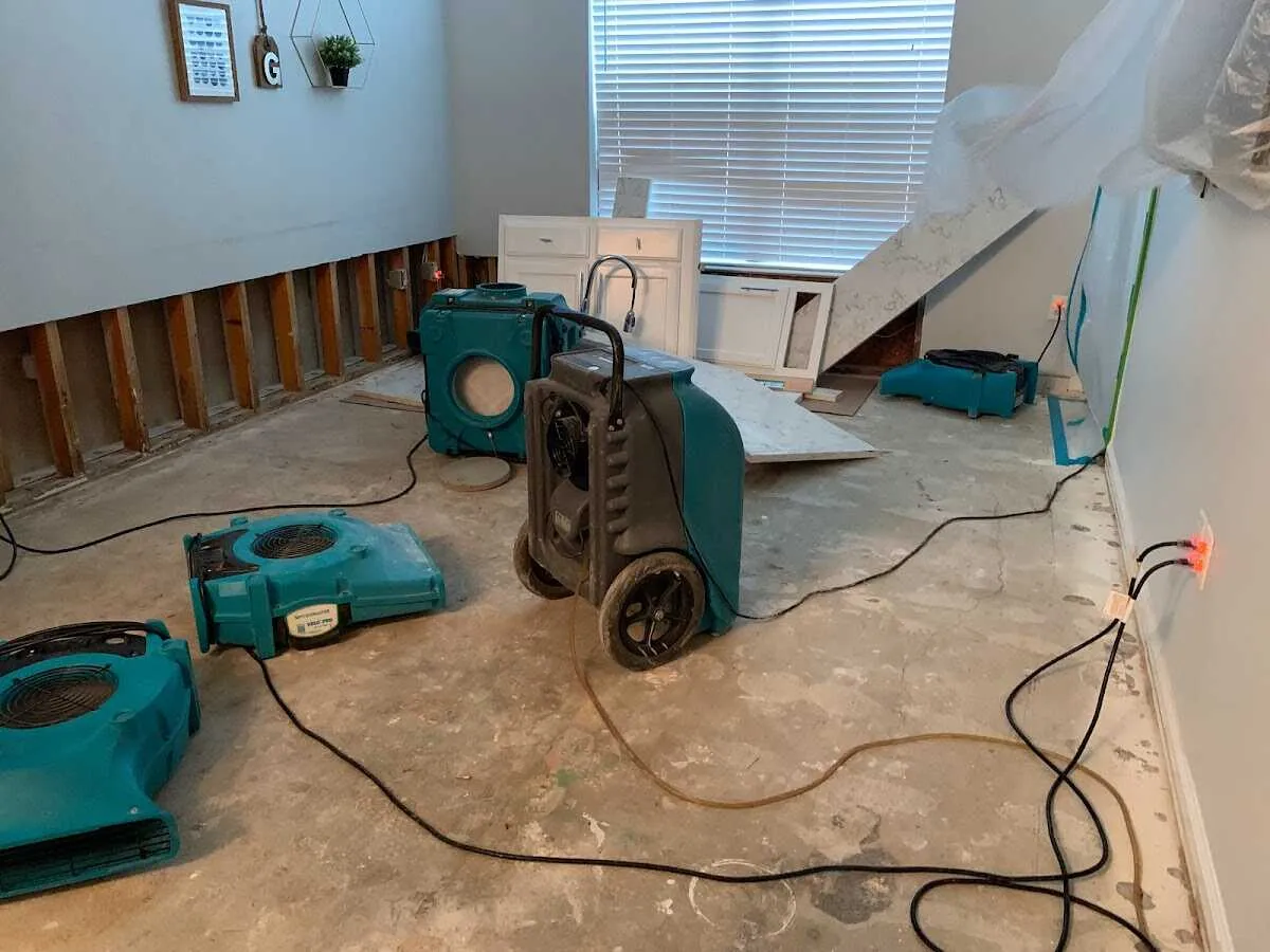 Dehumidifier in flood-cut room for Water Damage Restoration in Park City